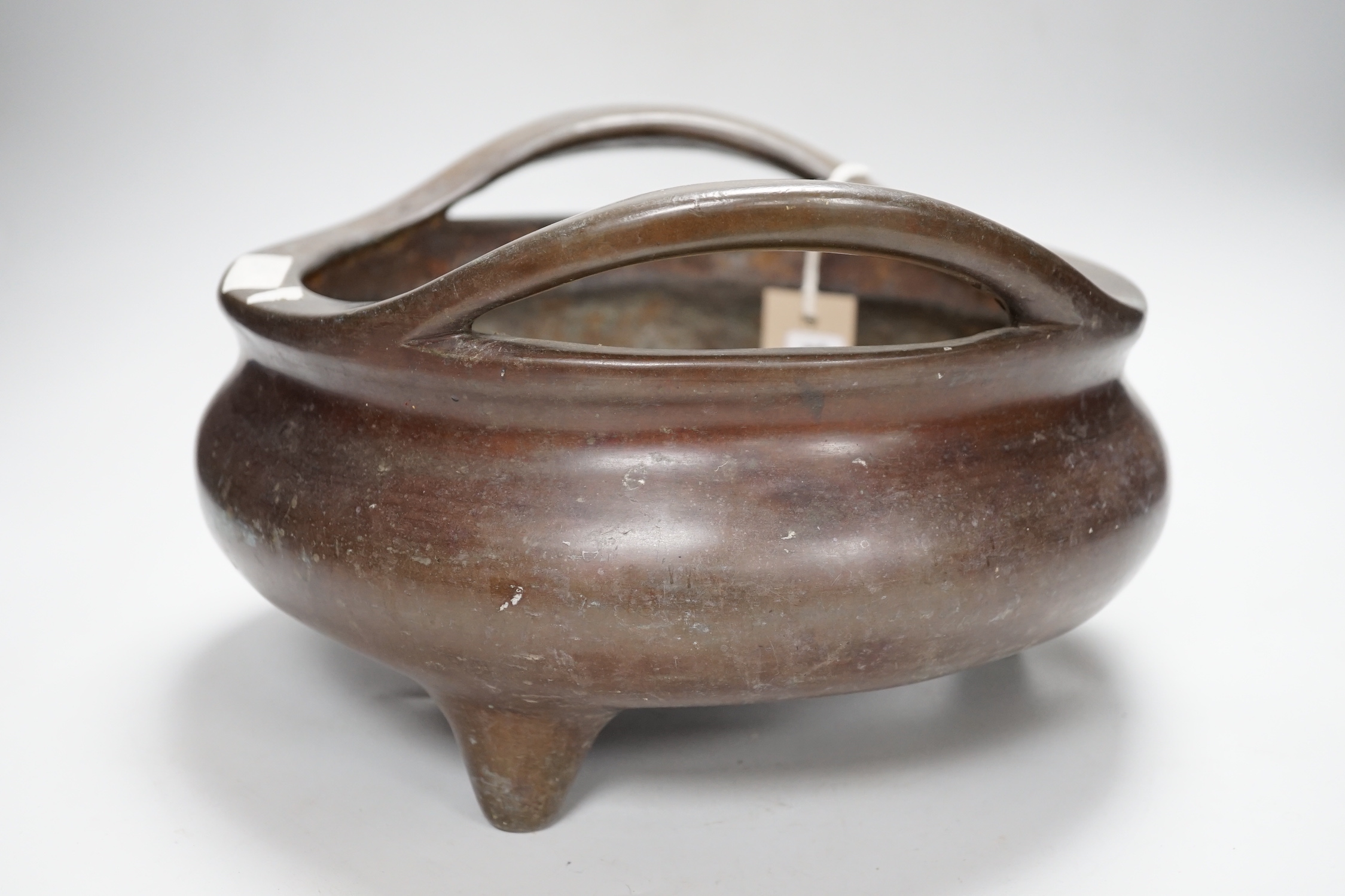 A large Chinese bronze censer, 30cm wide